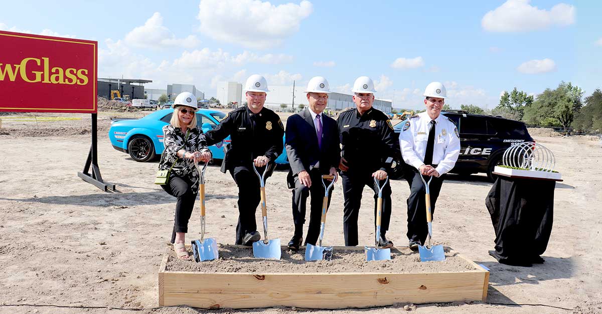 Mayor John Whitmire and Houston Police Department leaders participate in the North Belt Police Station groundbreaking ceremony, wearing hard hats and holding ceremonial shovels at the construction site under a sunny sky.
