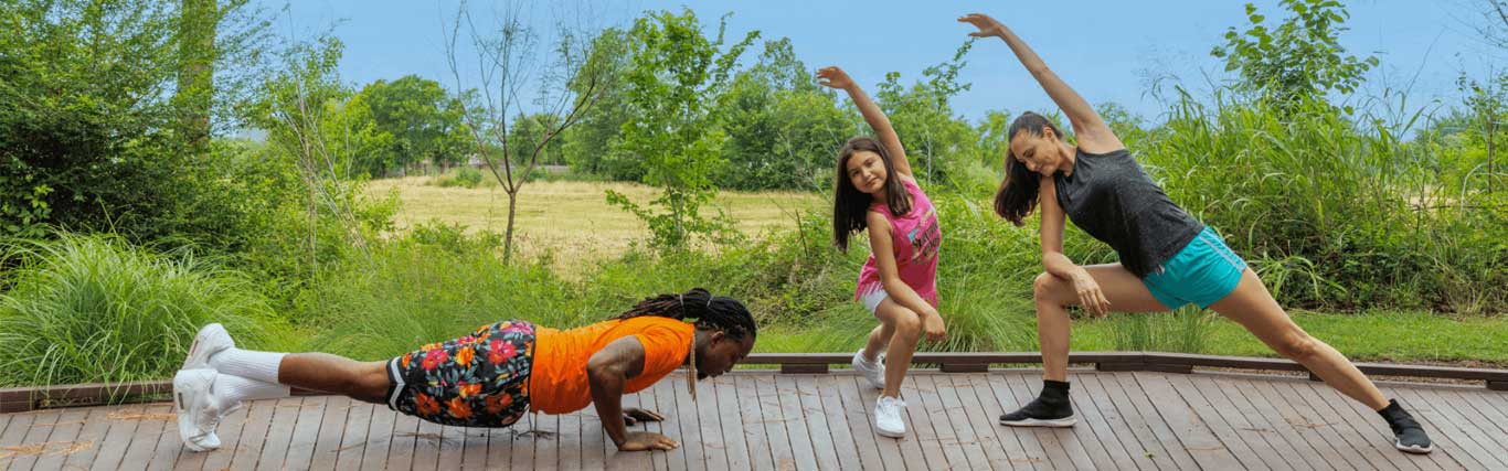 multiracial family exercising at the park 