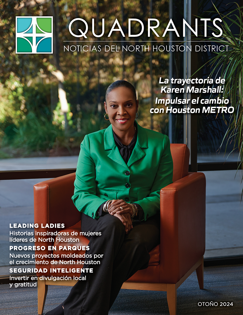 The image is the cover of Quadrants: North Houston District News for Fall 2024. in Spanish. It features Karen Marshall seated in an orange chair, wearing a green blazer and smiling confidently. The background includes large windows and greenery. The title reads, "Karen Marshall's Journey: Driving Change with Houston METRO." Highlights include "Leading Ladies," "Parks Progress," and "Savvy Safety," showcasing stories about leadership, community growth, and outreach. The North Houston District logo is in the upper-left corner.