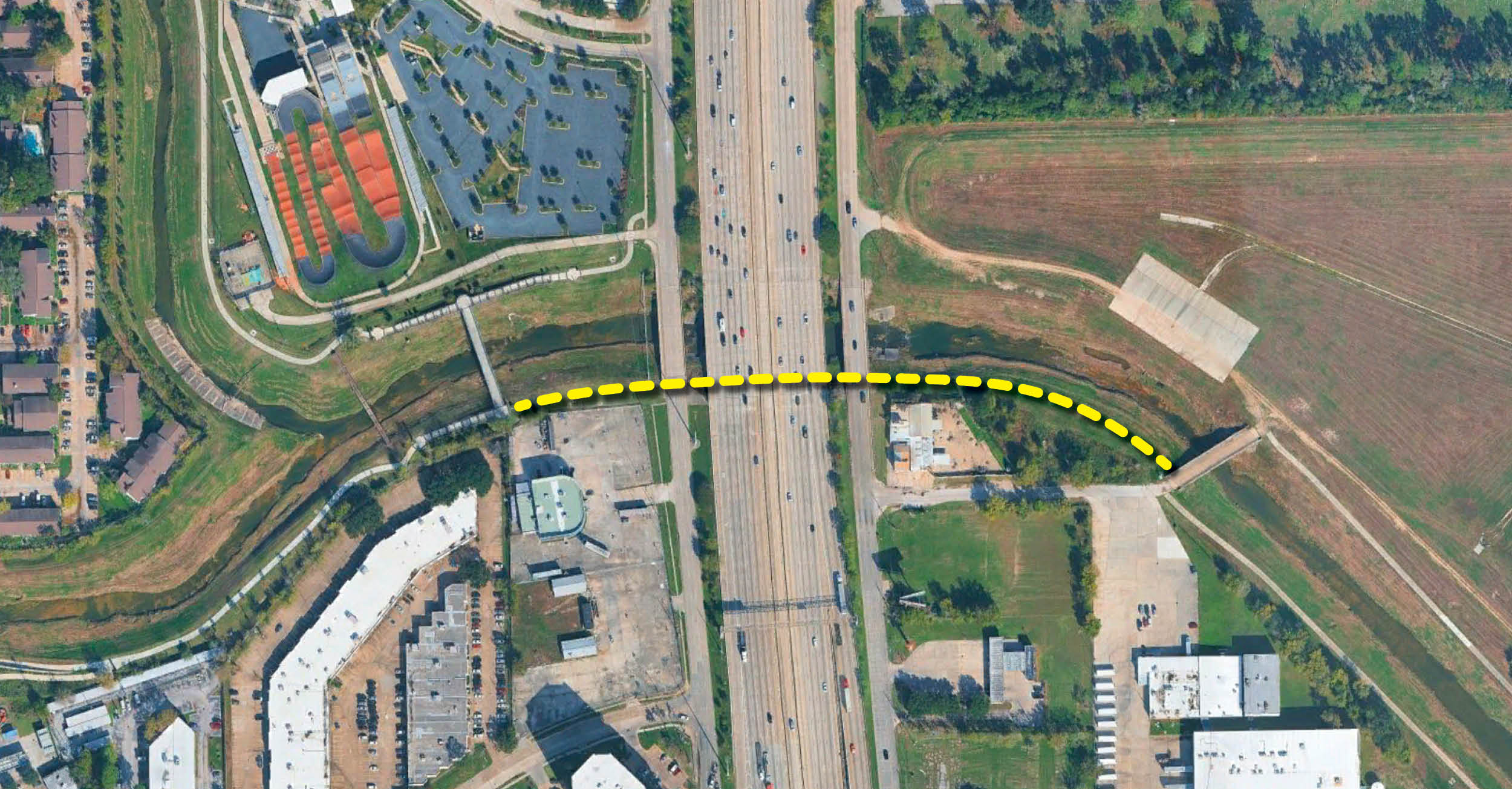 Aerial map graphic showing the planned Greens Bayou Trail Connector route crossing over Interstate 45. A yellow dashed line illustrates the proposed connection between trails on both sides of the freeway near Greens Bayou.
